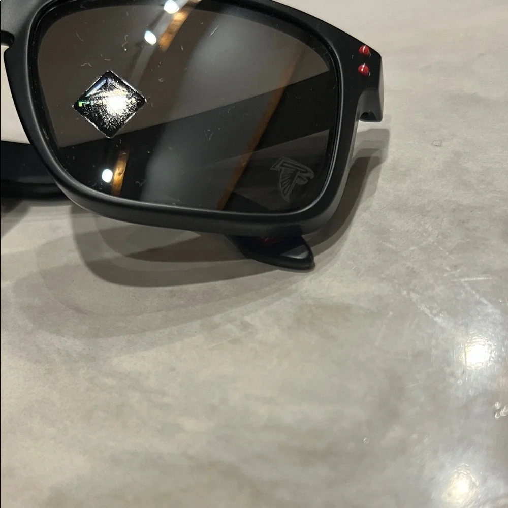 Official Oakley NFL Falcons Holbrook Black Sunglasses with Red Accents